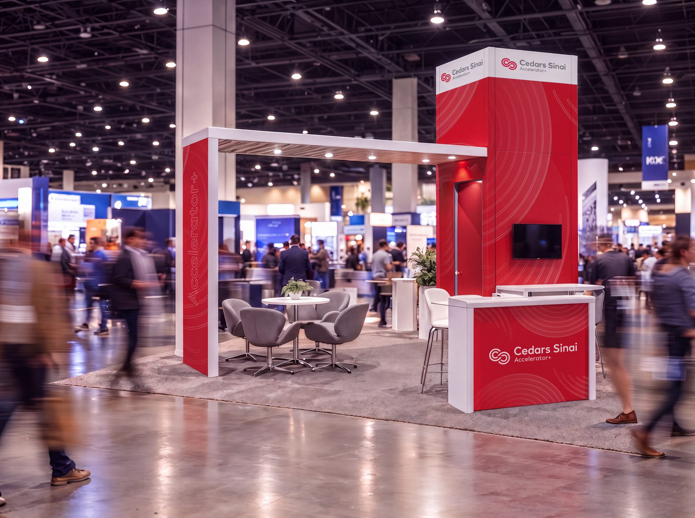 Cedars-Sinai Accelerator trade-show booth in red, on a busy exhibition hall floor
